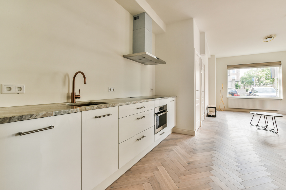 Spacious Bright White Kitchen with Corridor